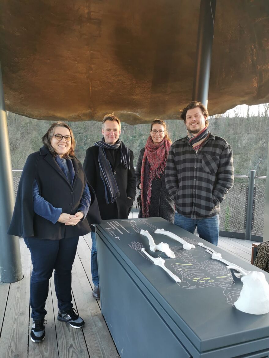 Two women and two men posing at the top of the Höhlenview Tower at Neanderthal