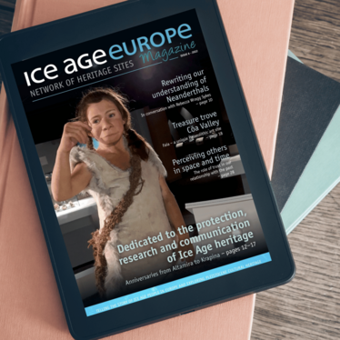Ice Age Europe Magazine Cover visible on a tablet on a table