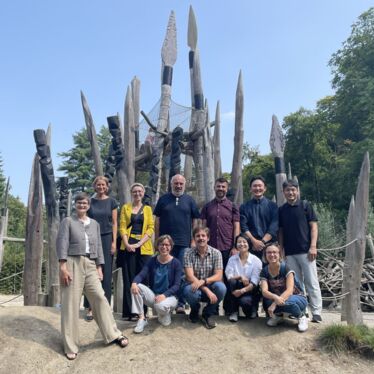 A group of people posing at the Stone Age playground