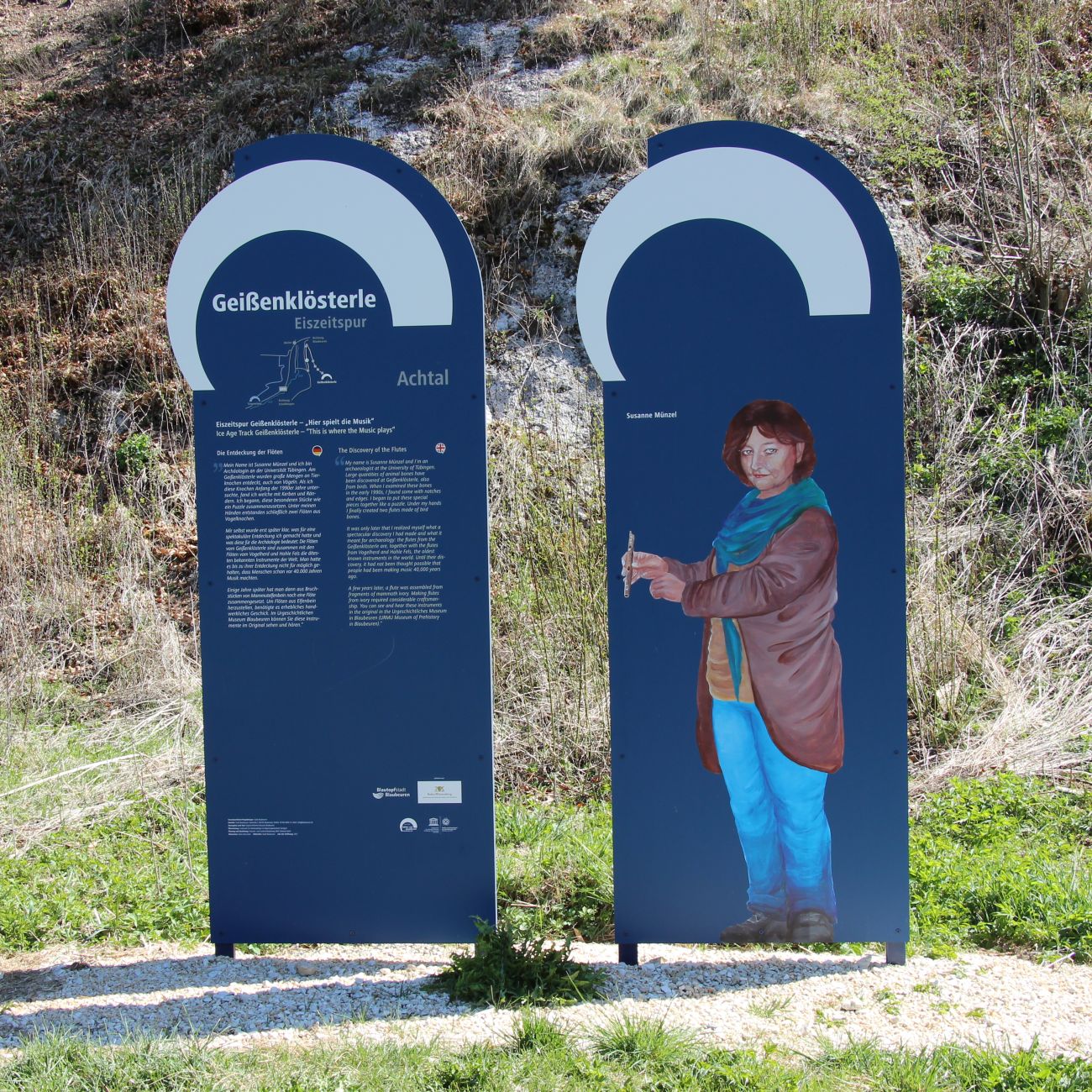 two outdoor information panels with text and images