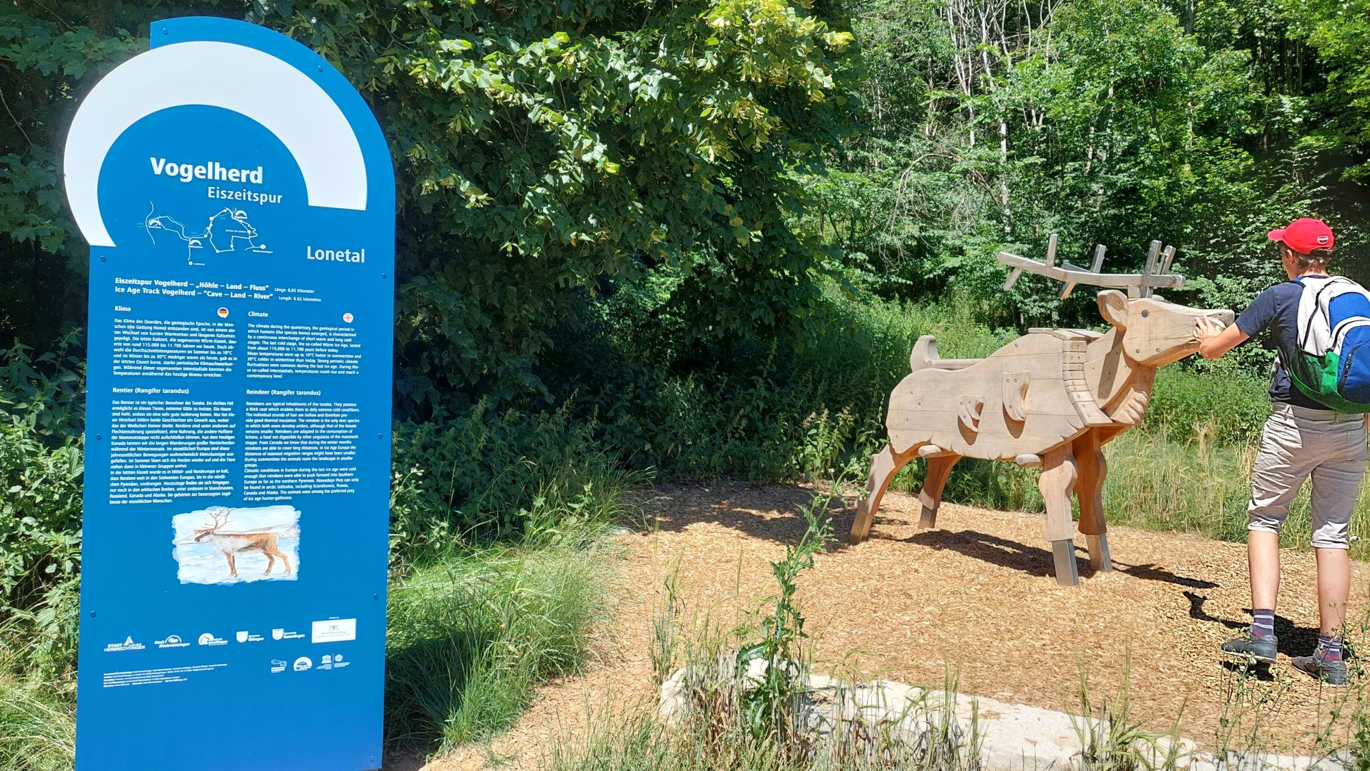 Information display and live size animal figure outdoors