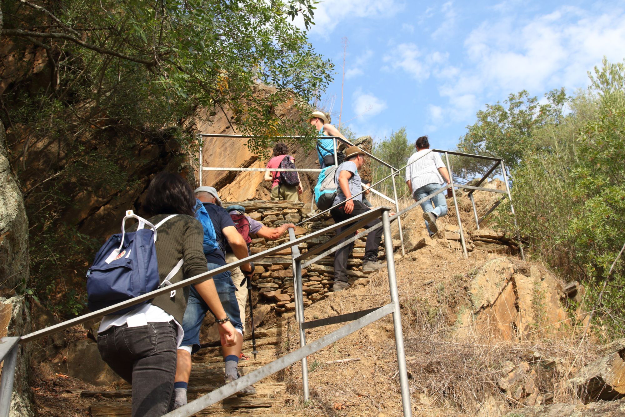 A group hiking up a hill