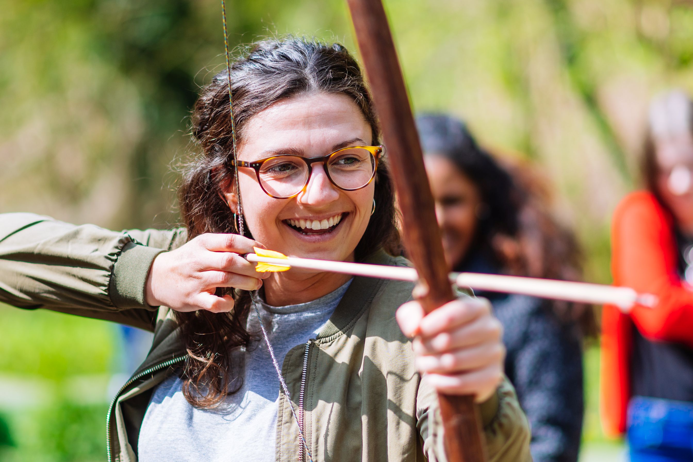 A woman shooting archery.