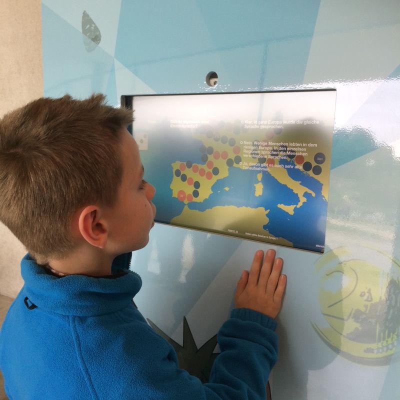 A young student playing the interactive dice game at the terminal
